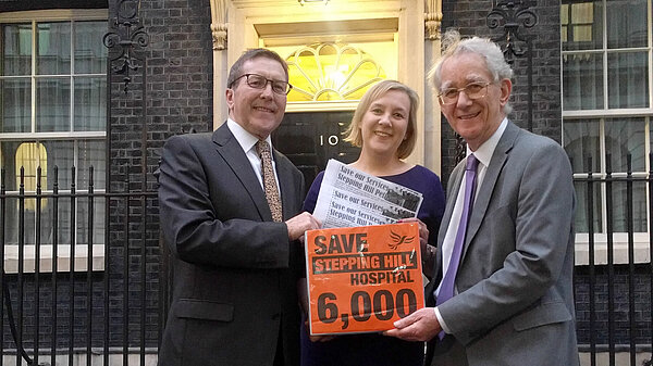 Mark Hunter, Lisa Smart and Andrew Stunell present the petition to Downing Street